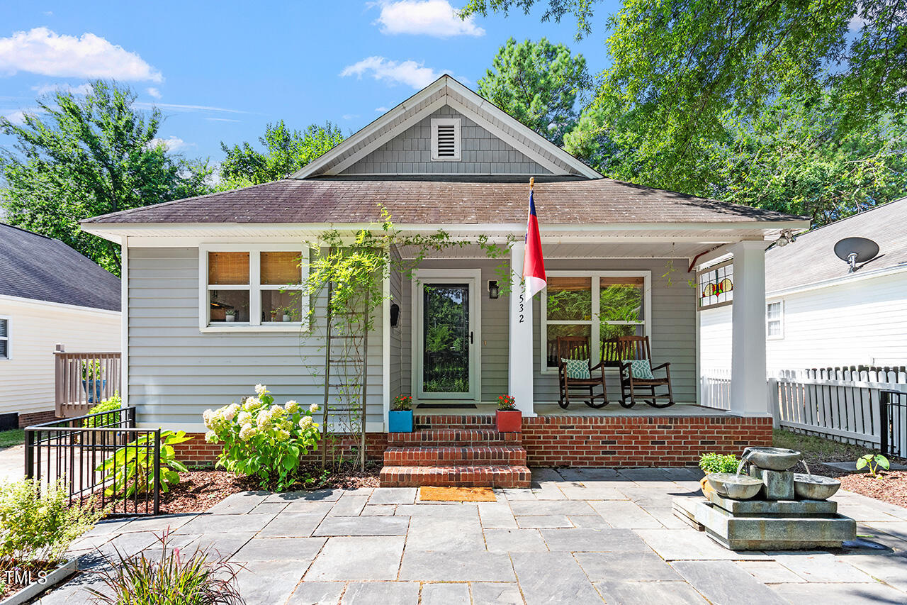 a front view of a house with garden