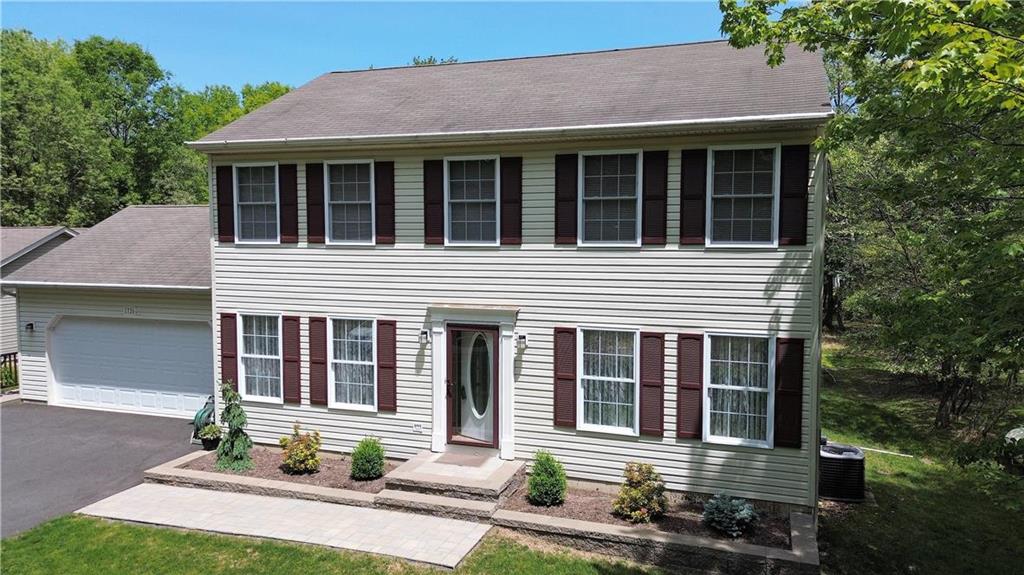 front view of a house with a yard