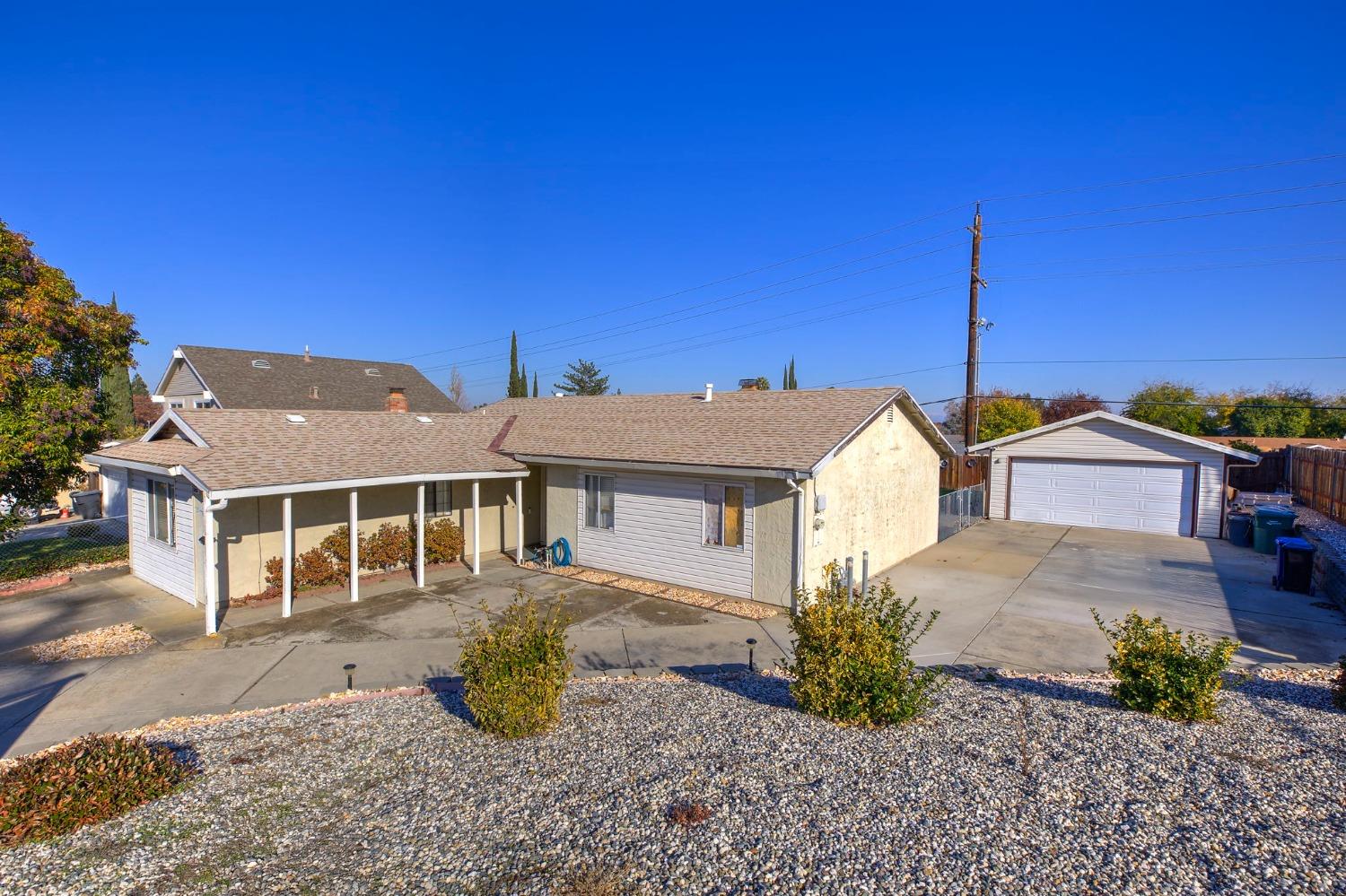 Sitting on a hill, this cozy home offers lots of space inside and out!