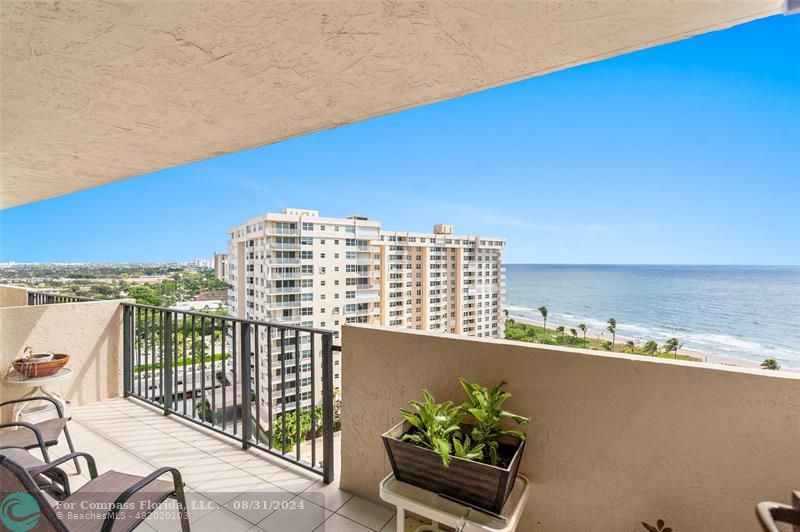 a view of balcony with furniture