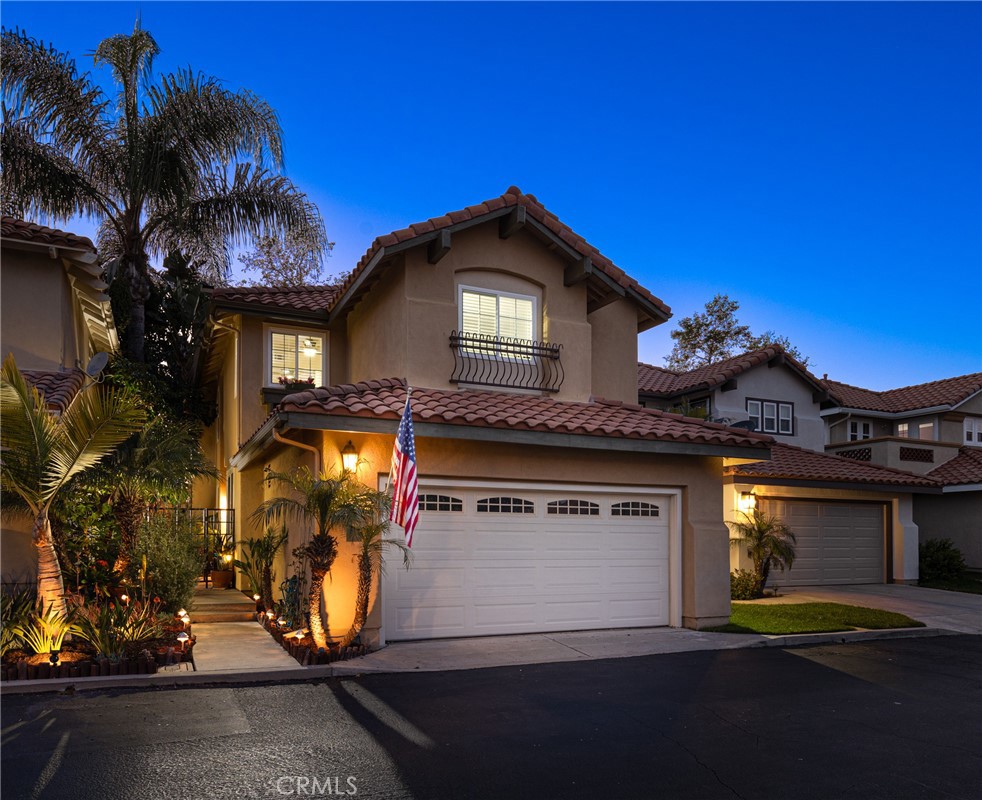 a view of a house with a yard and garage