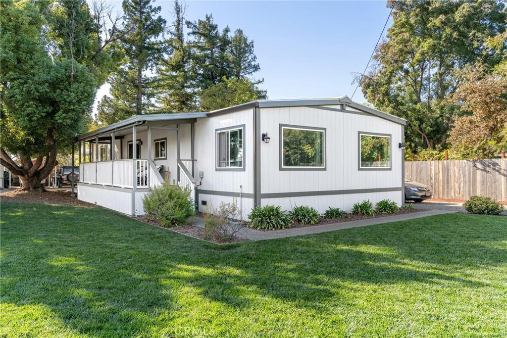 a front view of house with yard and green space