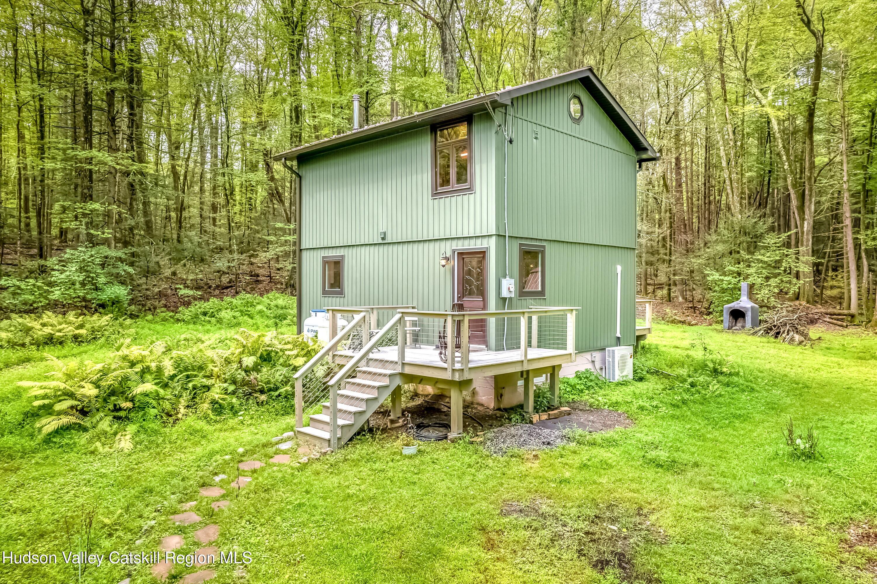 a house that has sitting area in backyard