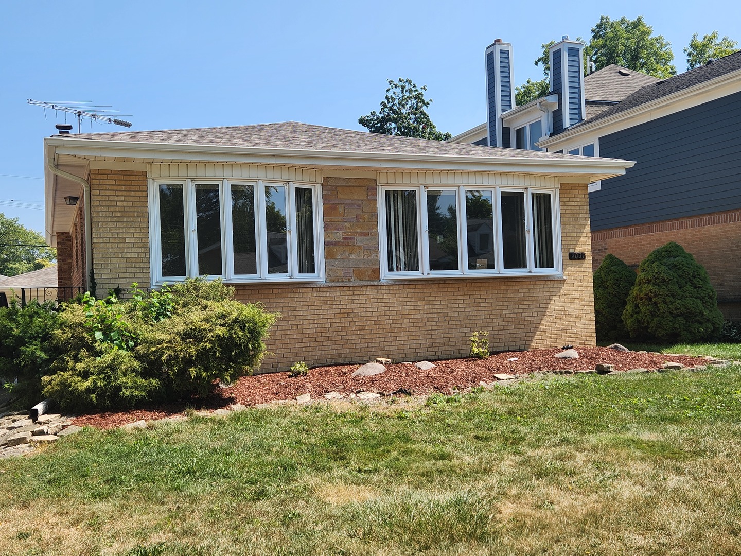 front view of a house with a yard