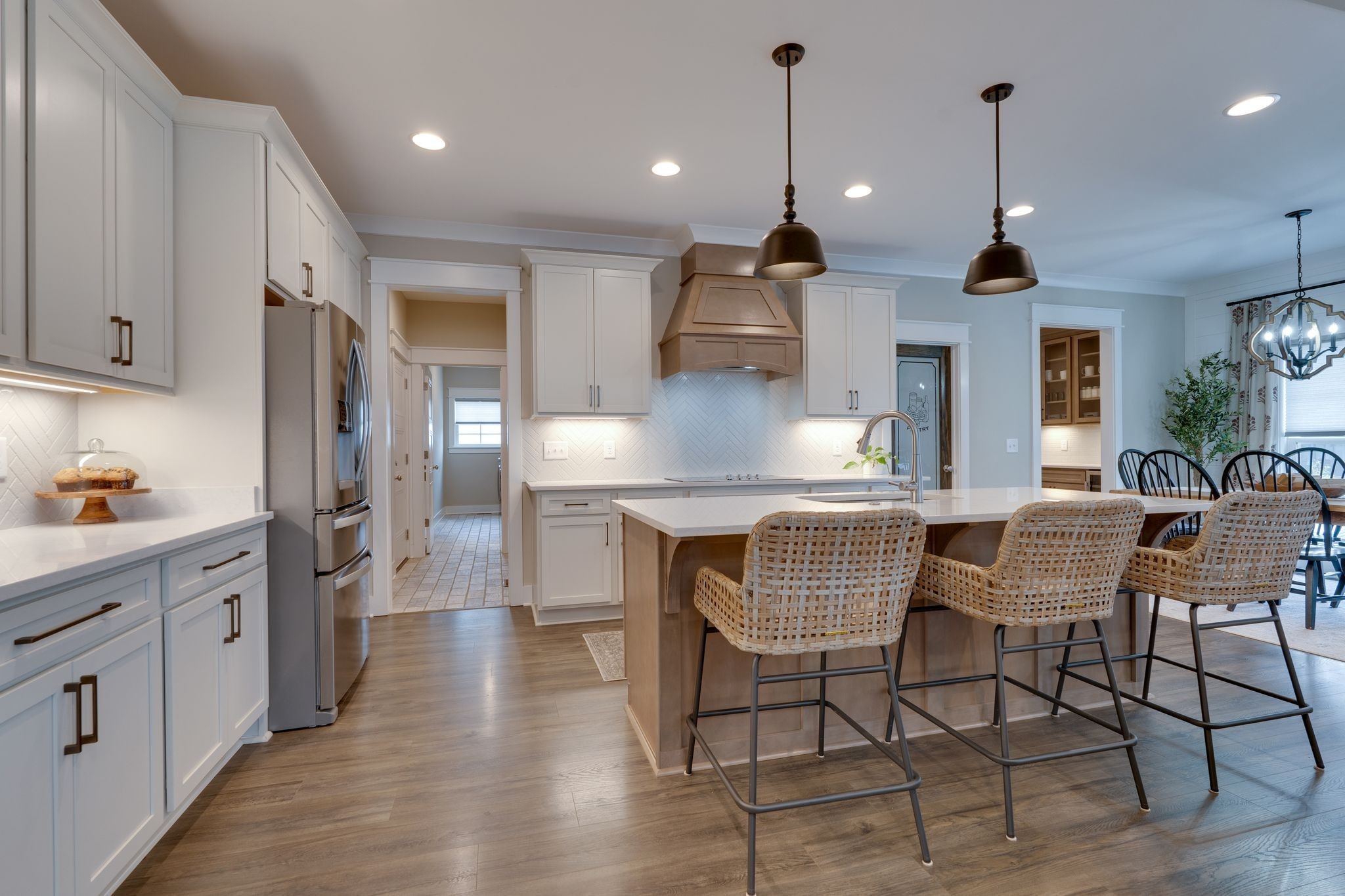 a kitchen with stainless steel appliances granite countertop a kitchen island a stove and a cabinets