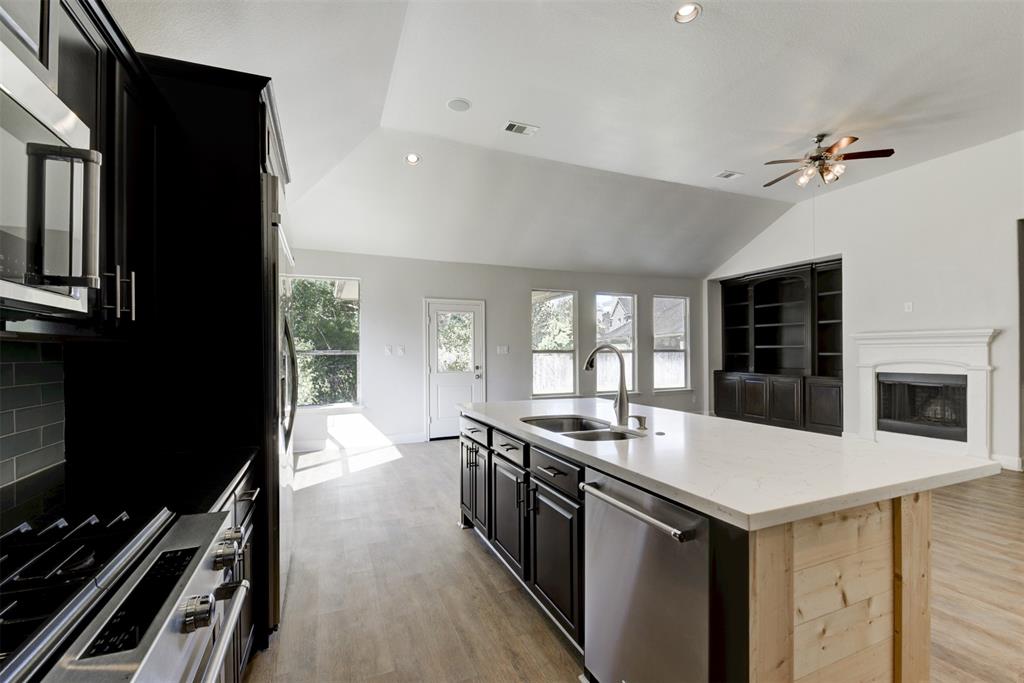 a kitchen with a stove and a sink