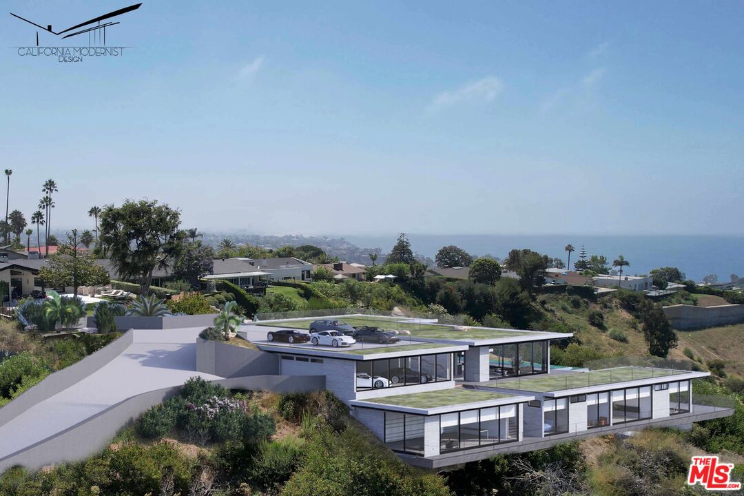 an aerial view of a house with a garden