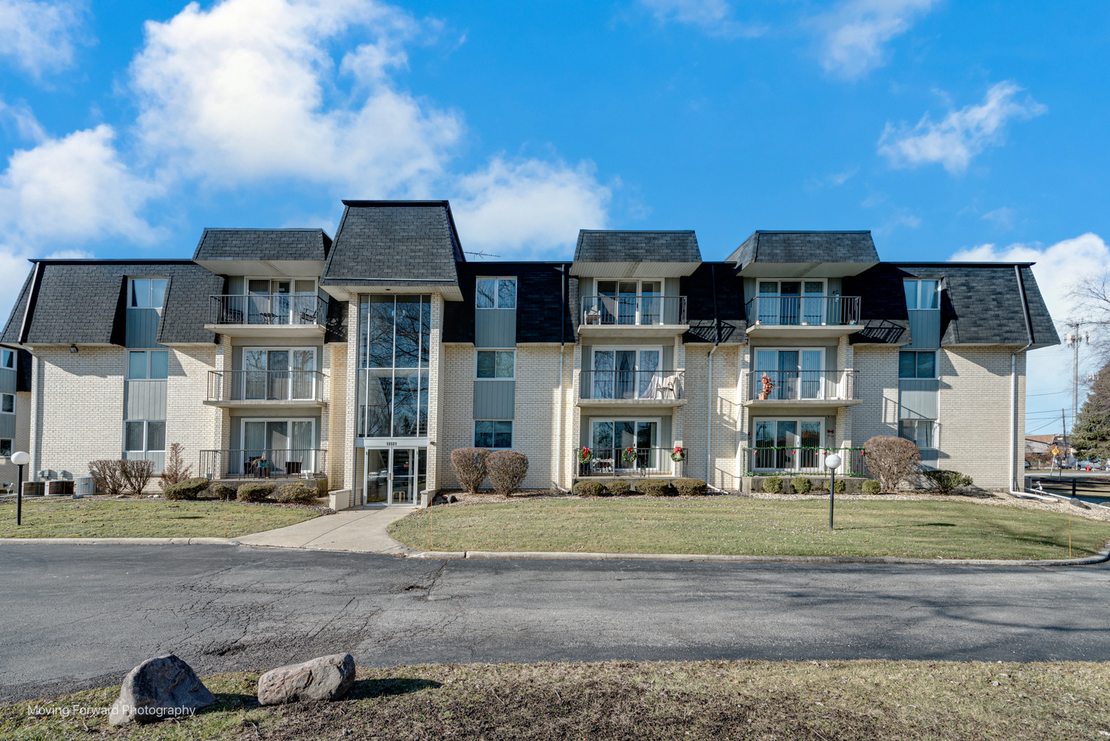 a front view of residential houses with yard