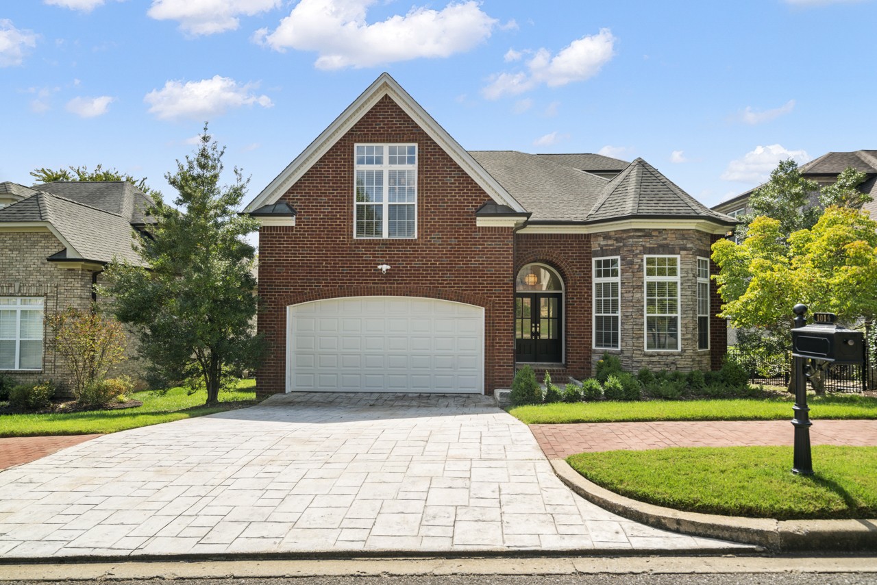 a front view of a house with yard