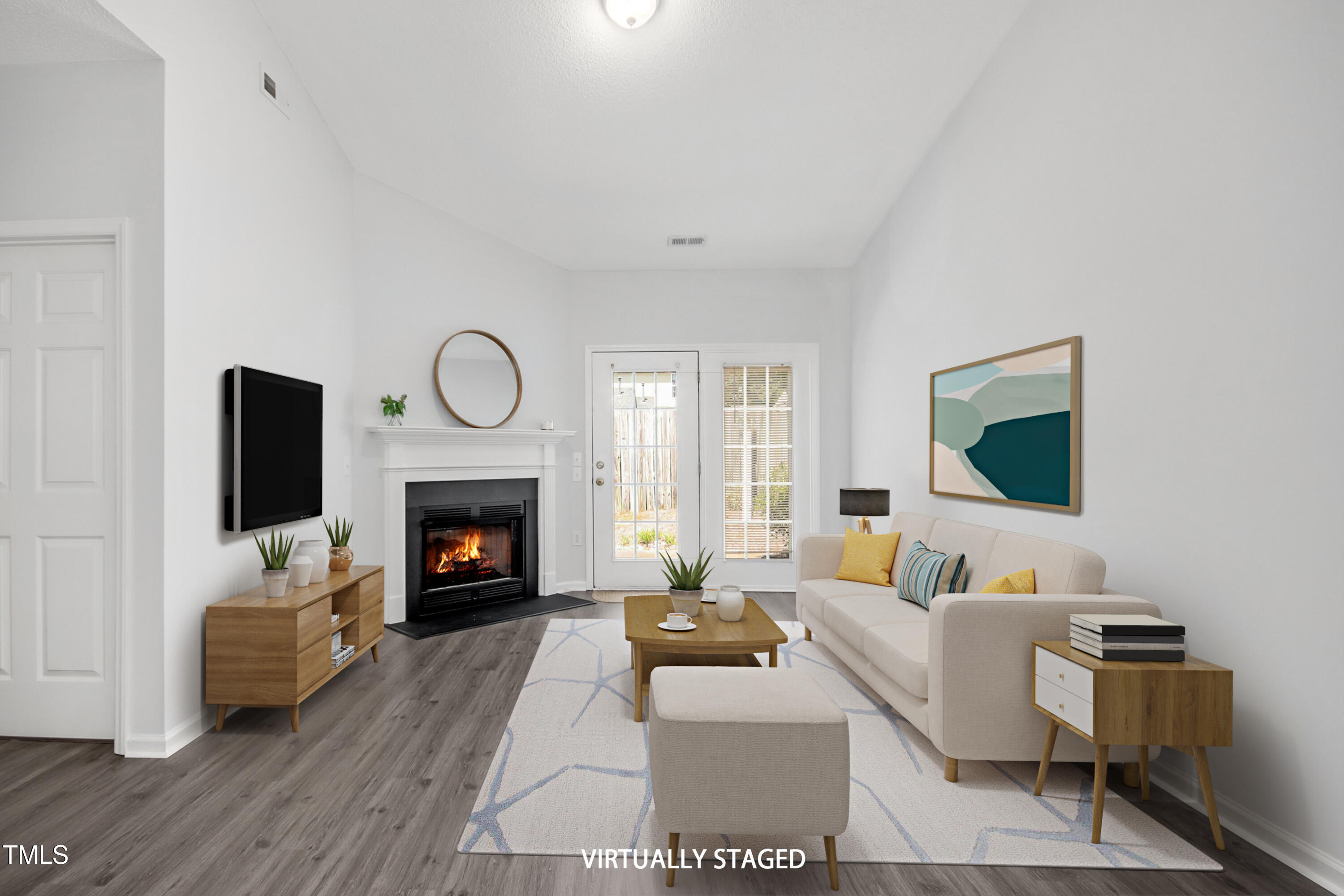 a living room with furniture a fireplace and a flat screen tv