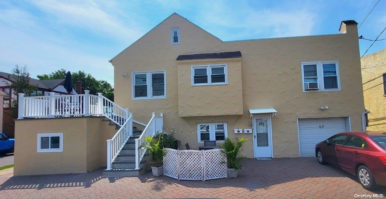 a front view of a house with garage