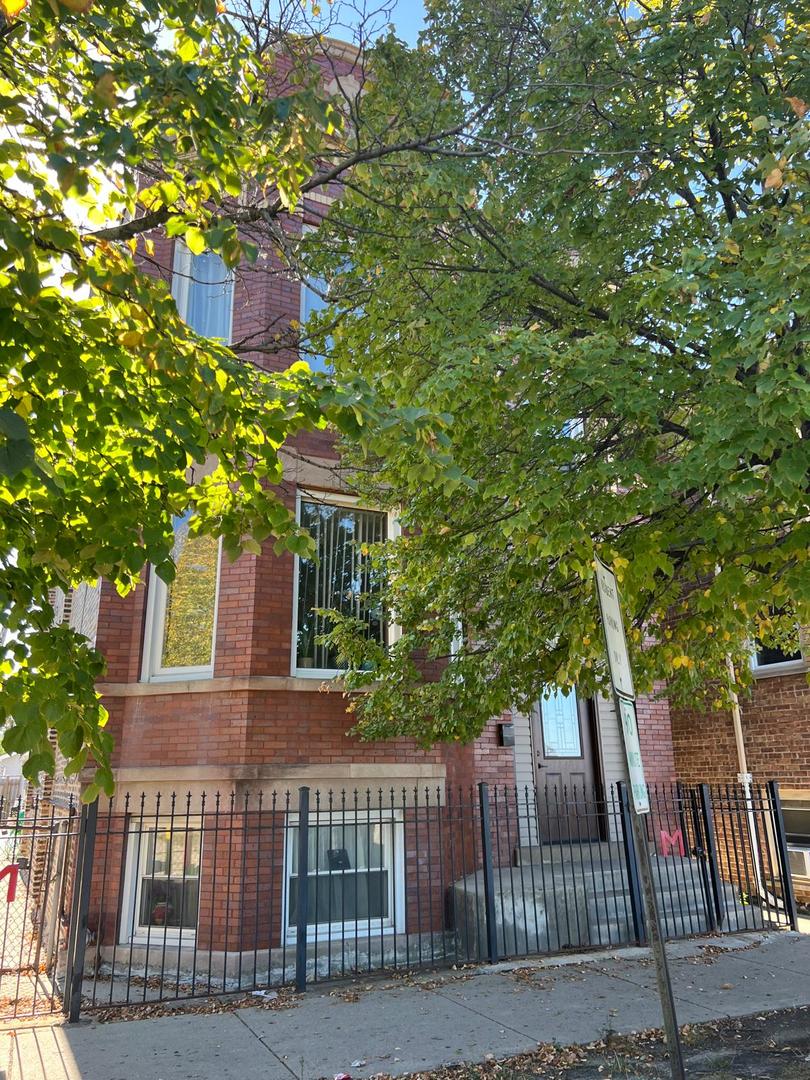 a view of a house with a tree