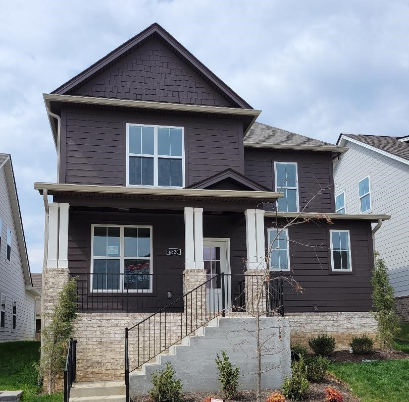 Welcome home! Rocking chair front porch. So many wonderful finishes inside - sand and finish hardwoods, lots of crown, quartz in kitchen and baths.