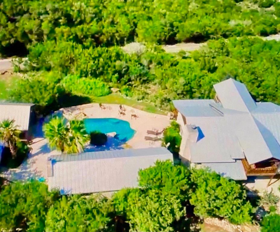 an aerial view of a house with a yard and a garden