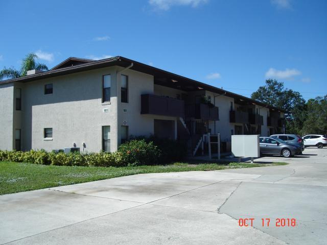 a view of a car park in front of house