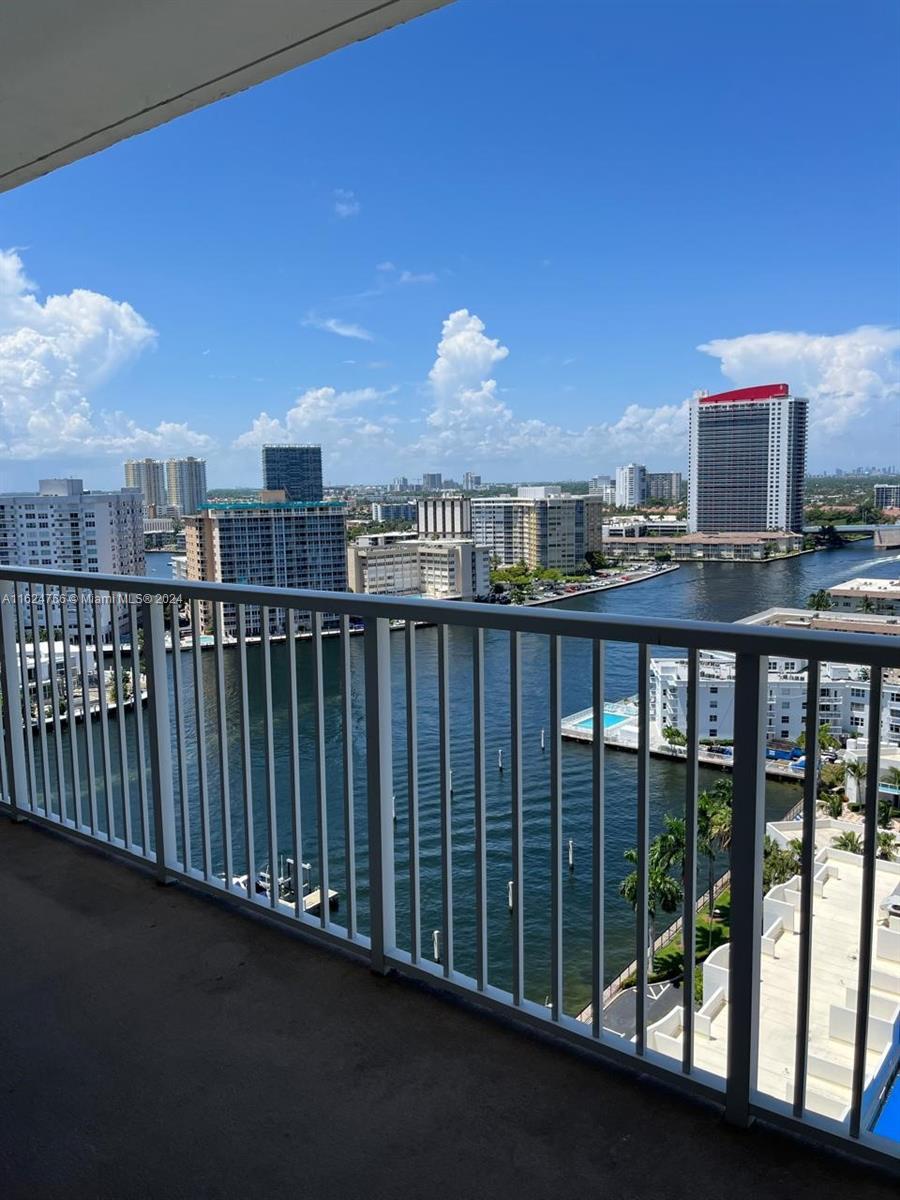 a balcony with a city view