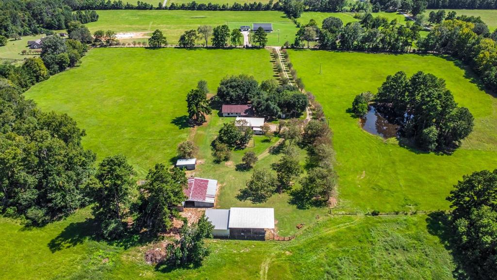 an aerial view of a houses with a garden