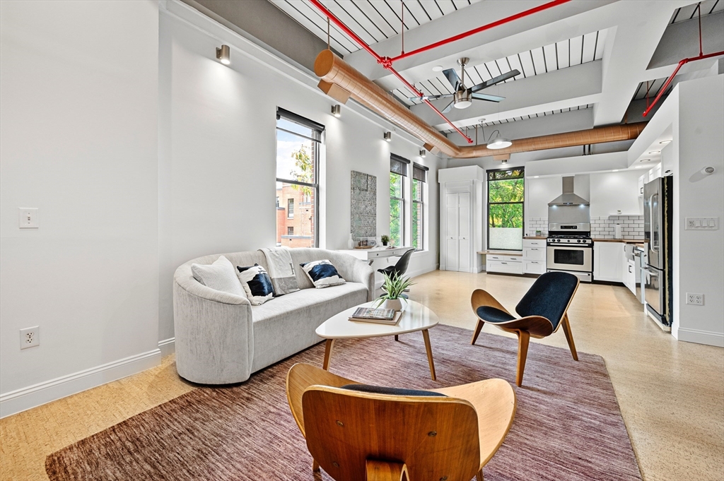 a living room with furniture and a table