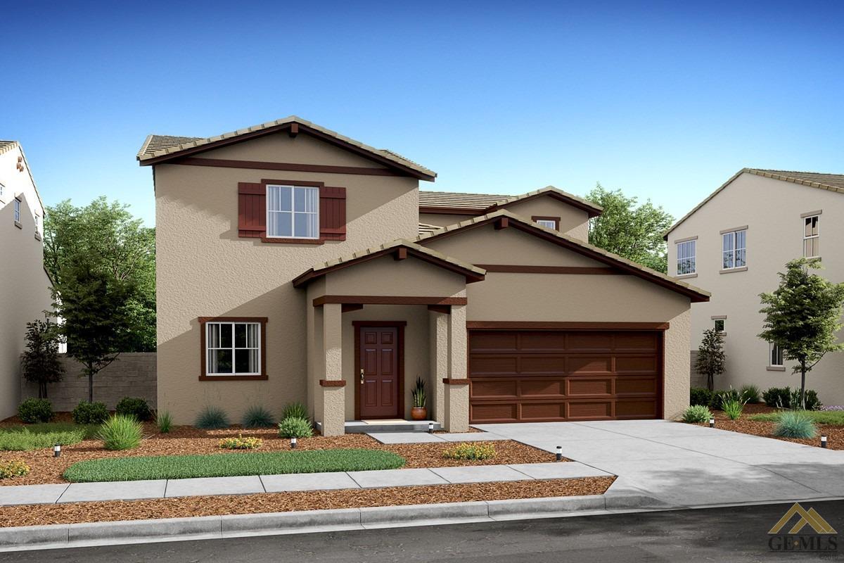 a front view of a house with garage and trees