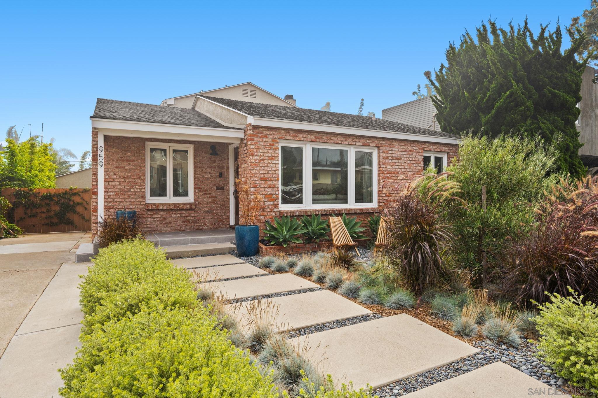 a front view of a house with garden