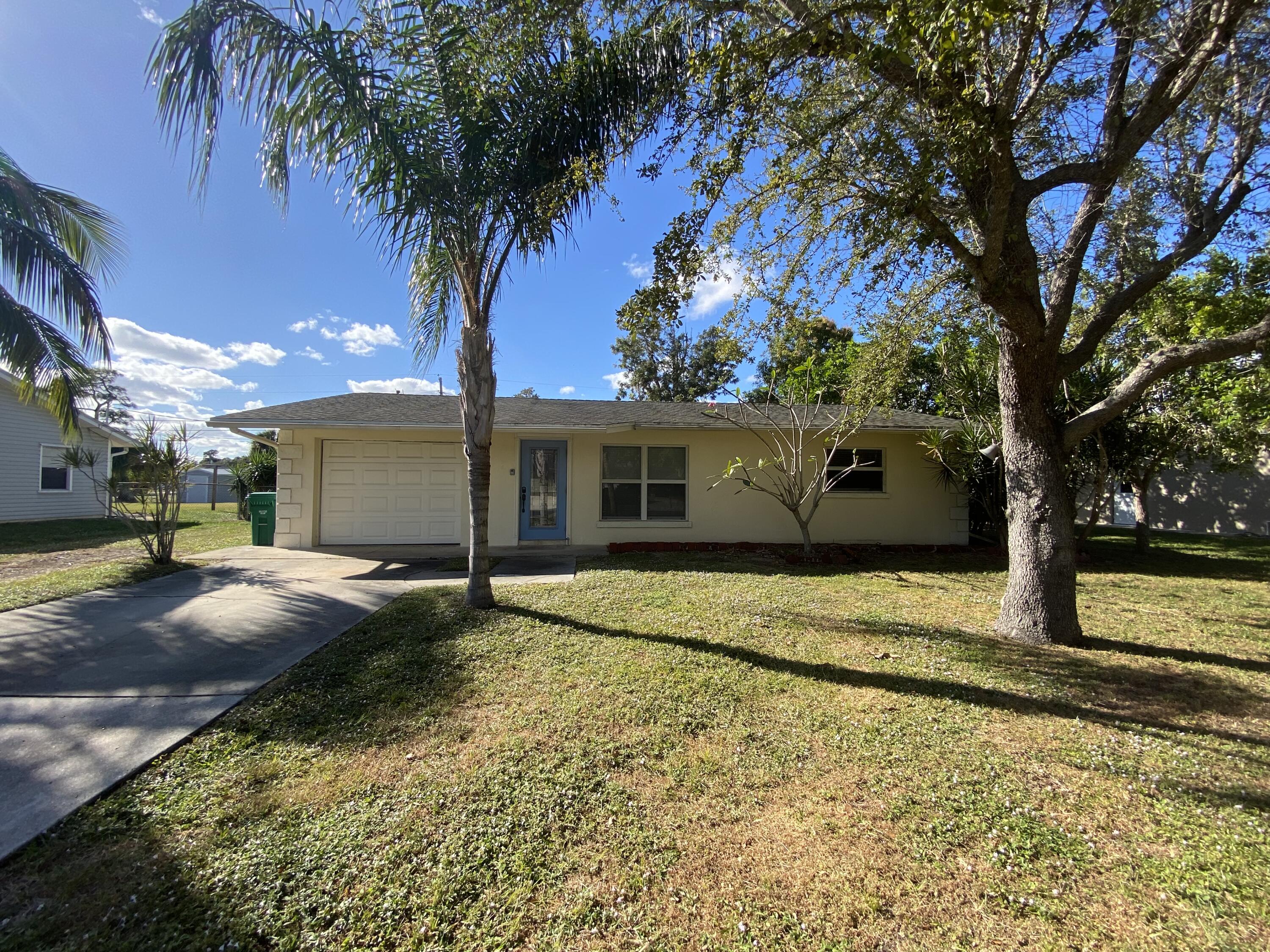 a house with yard in front of it