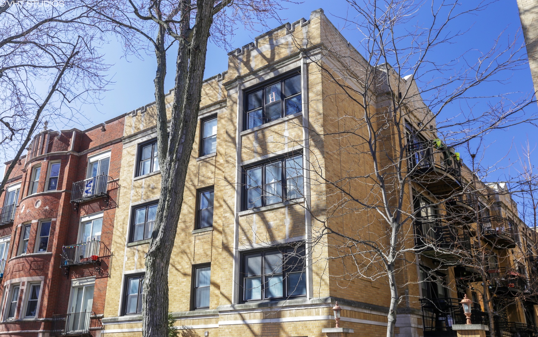 a view of a brick building next to a brick building