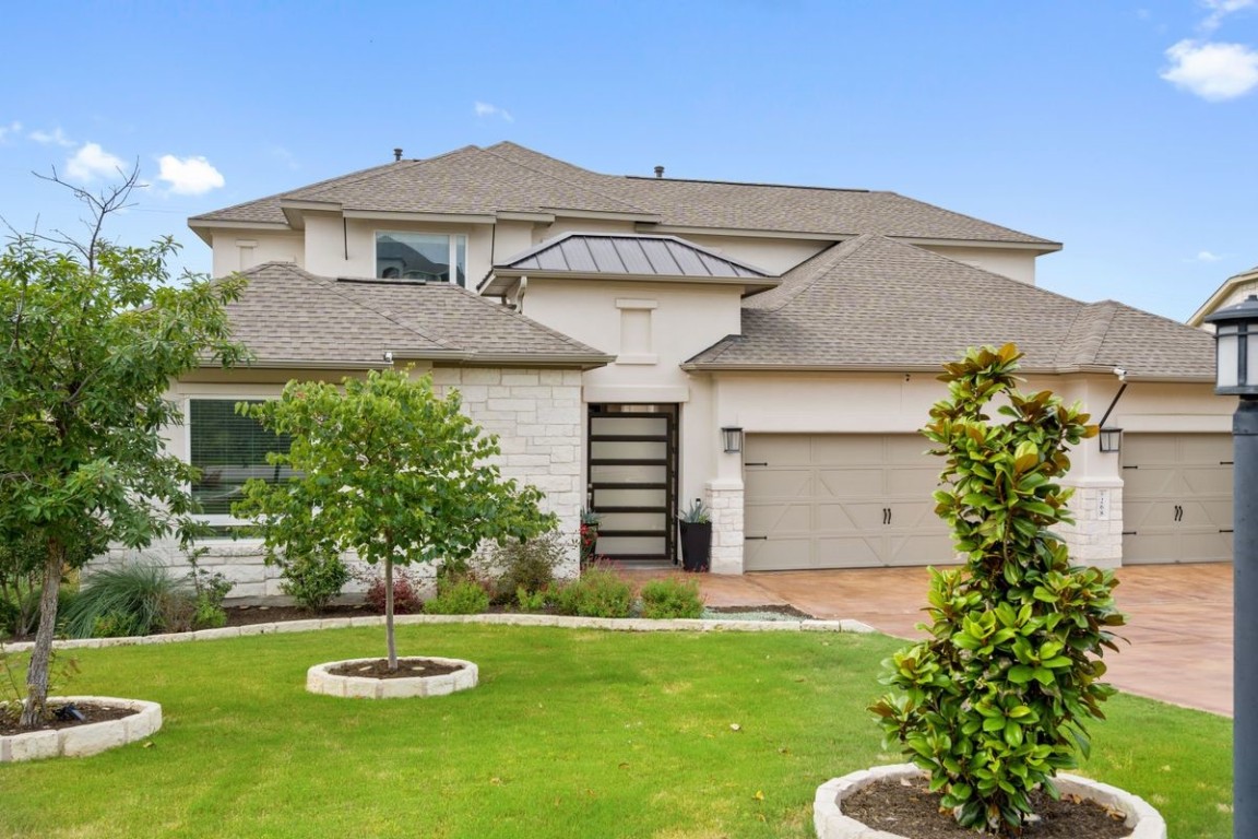 a front view of a house with a yard