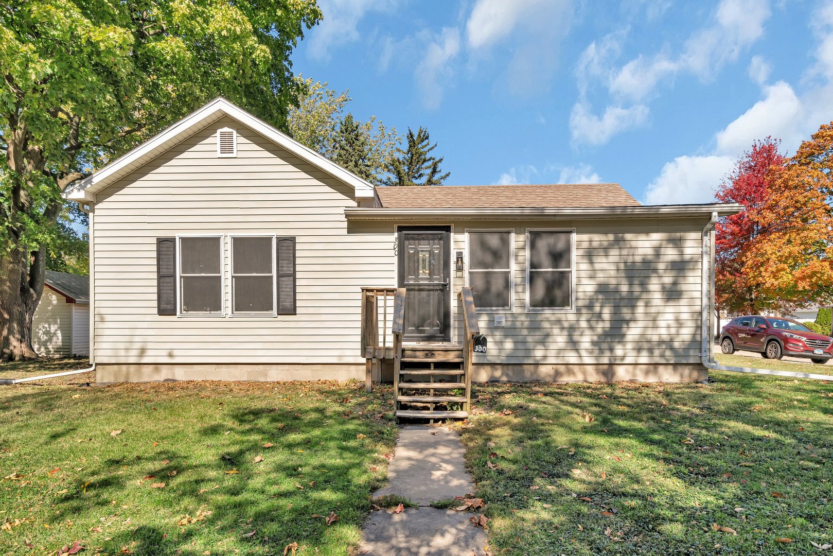 a view of house with backyard