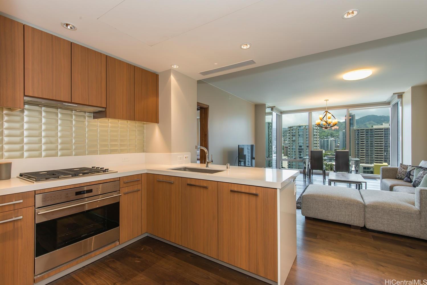 a view of a kitchen with a sink stove and cabinets