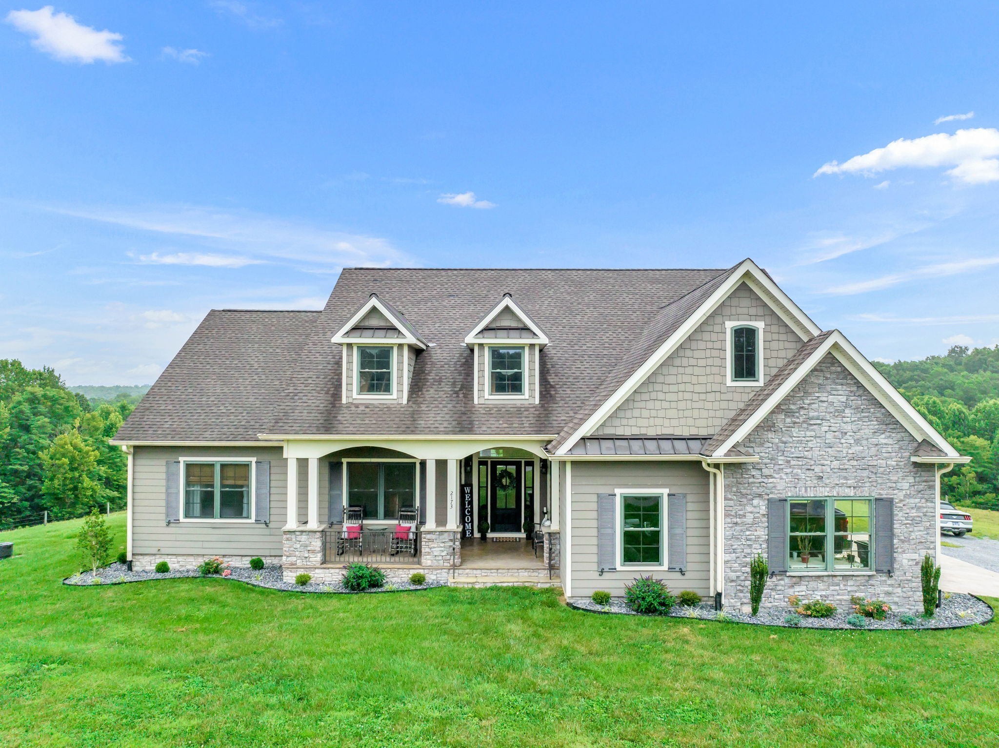 a front view of house with garden