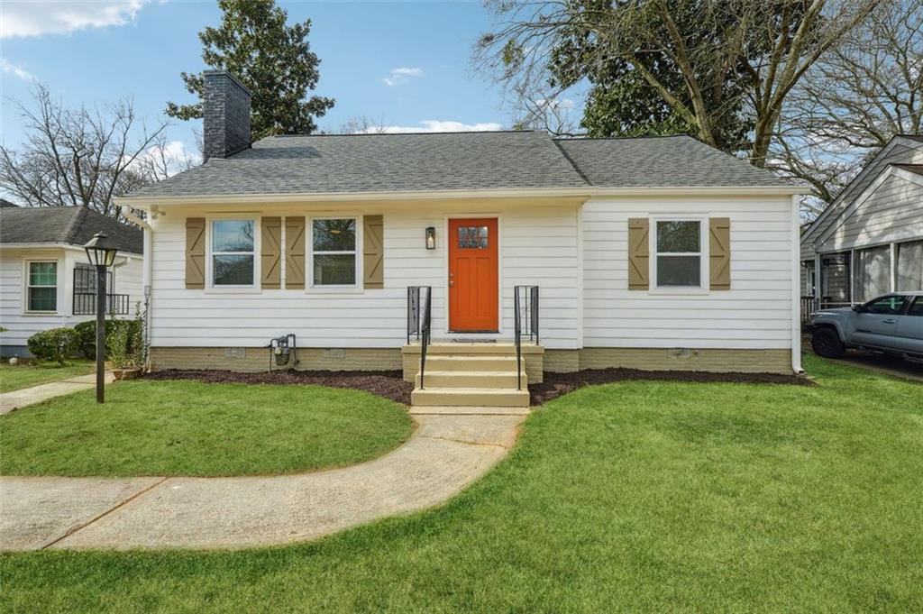 a front view of a house with garden