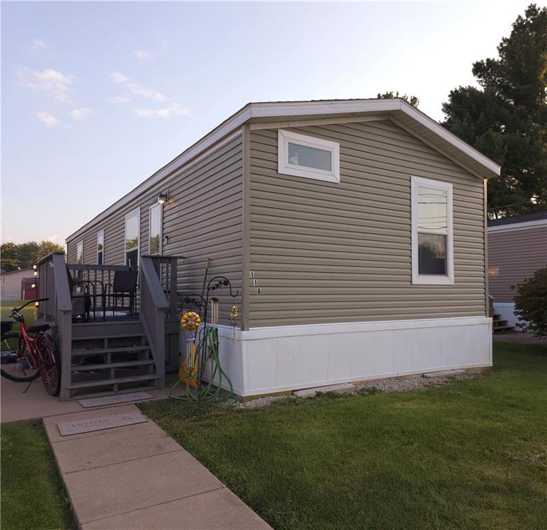 a view of house with backyard and tub