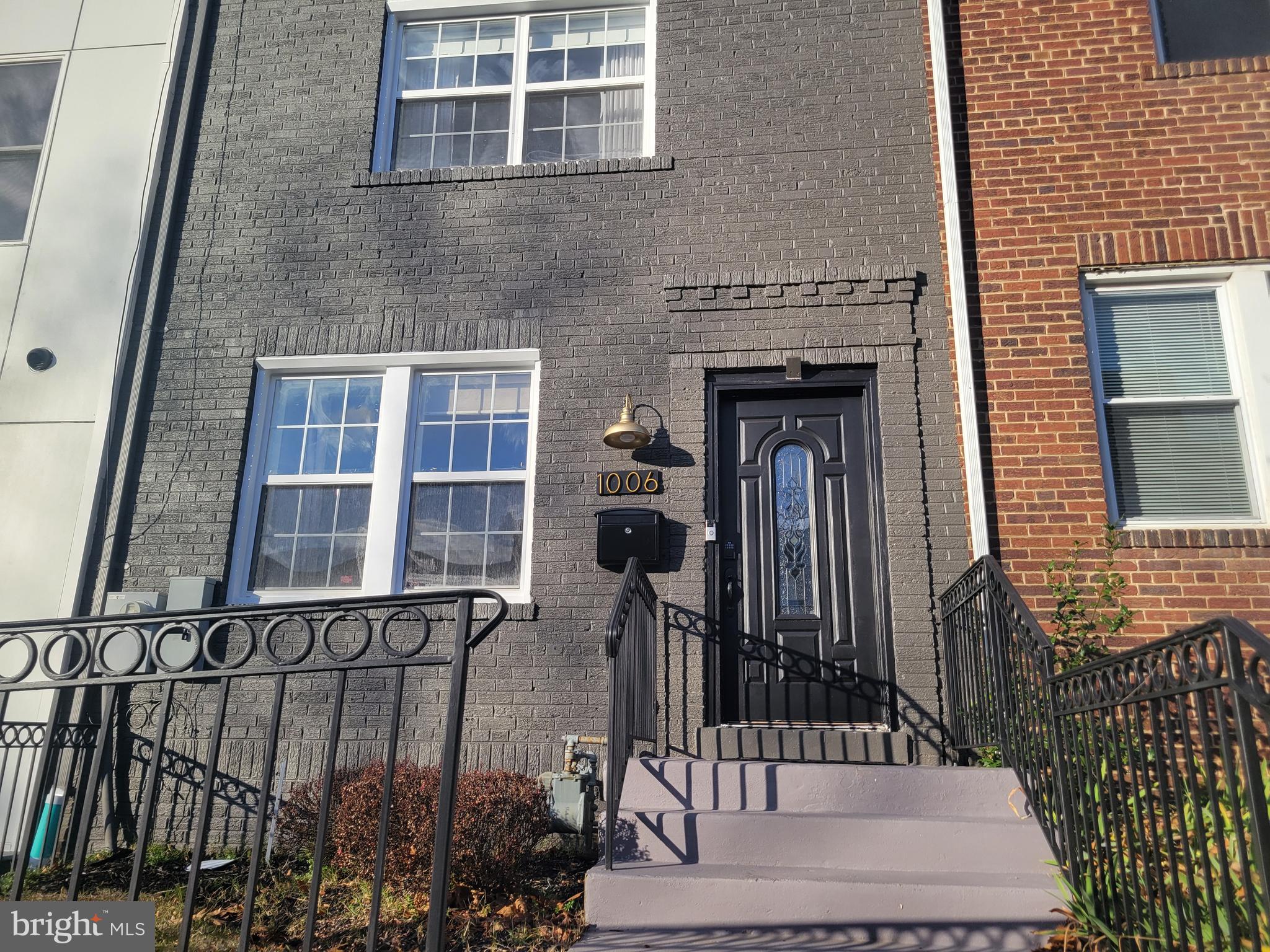 a front view of a house with glass windows