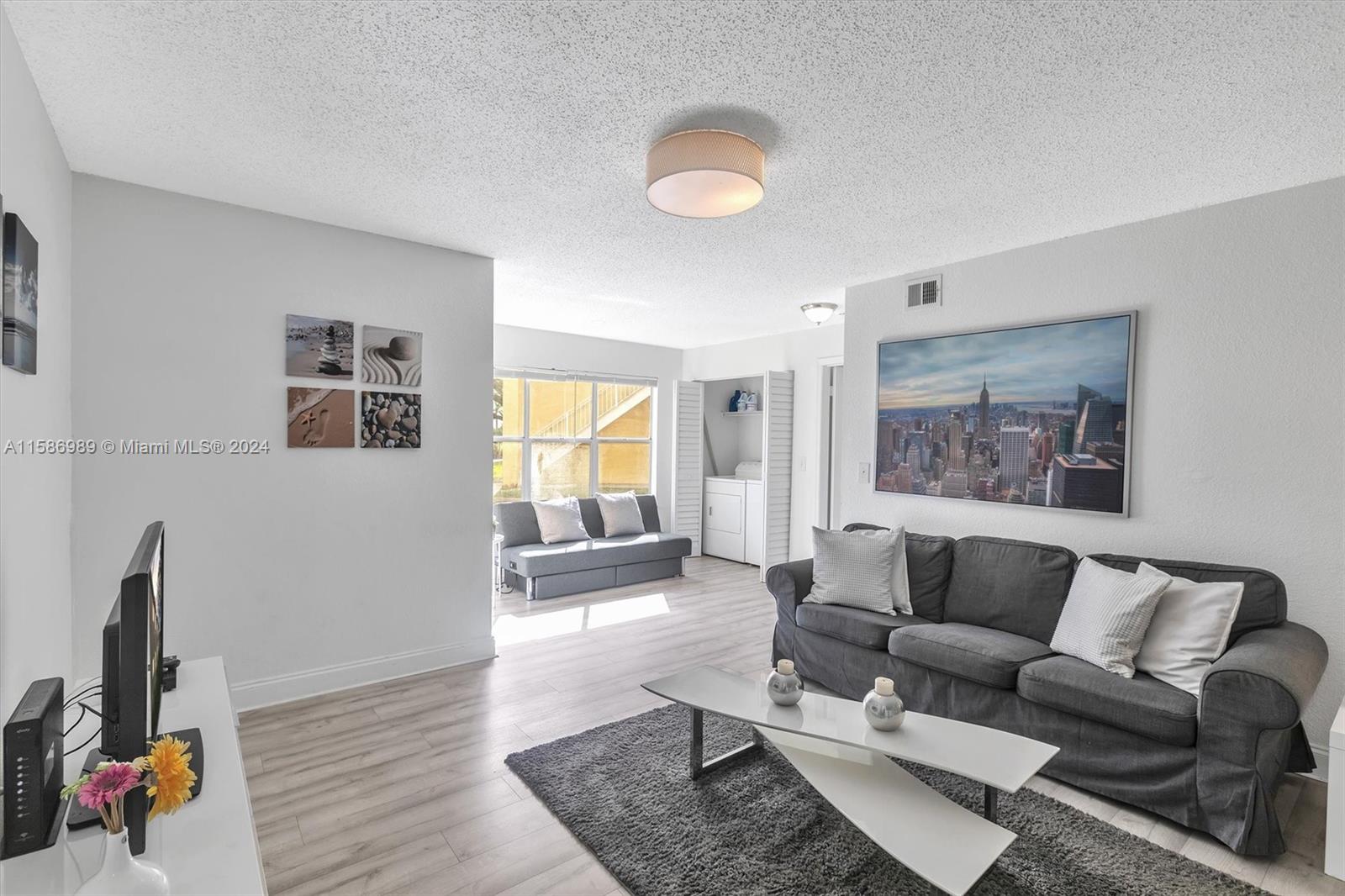 a living room with furniture and a window