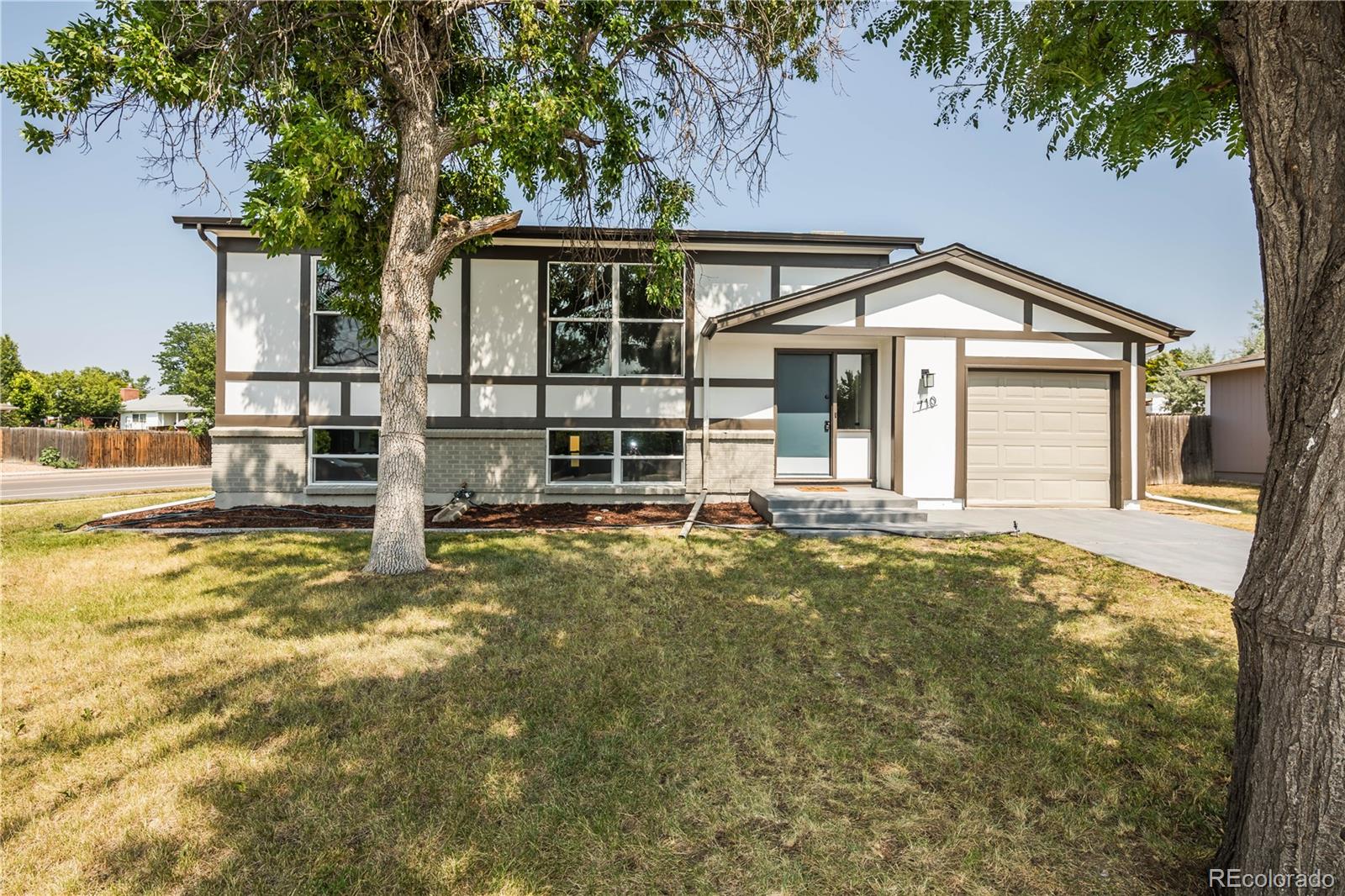 front view of a house with a yard