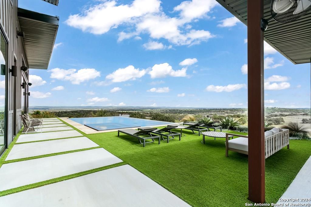 a view of swimming pool from a balcony