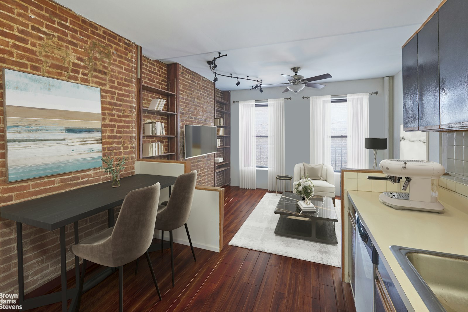 a living room with furniture a large window and wooden floor