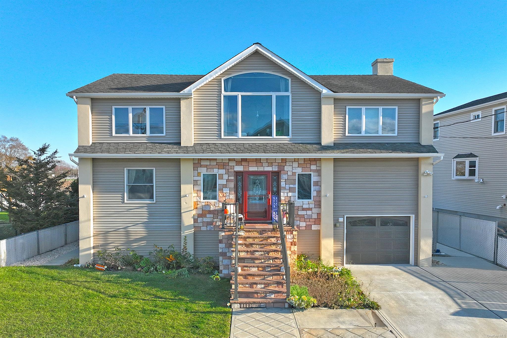 a front view of a house with garden