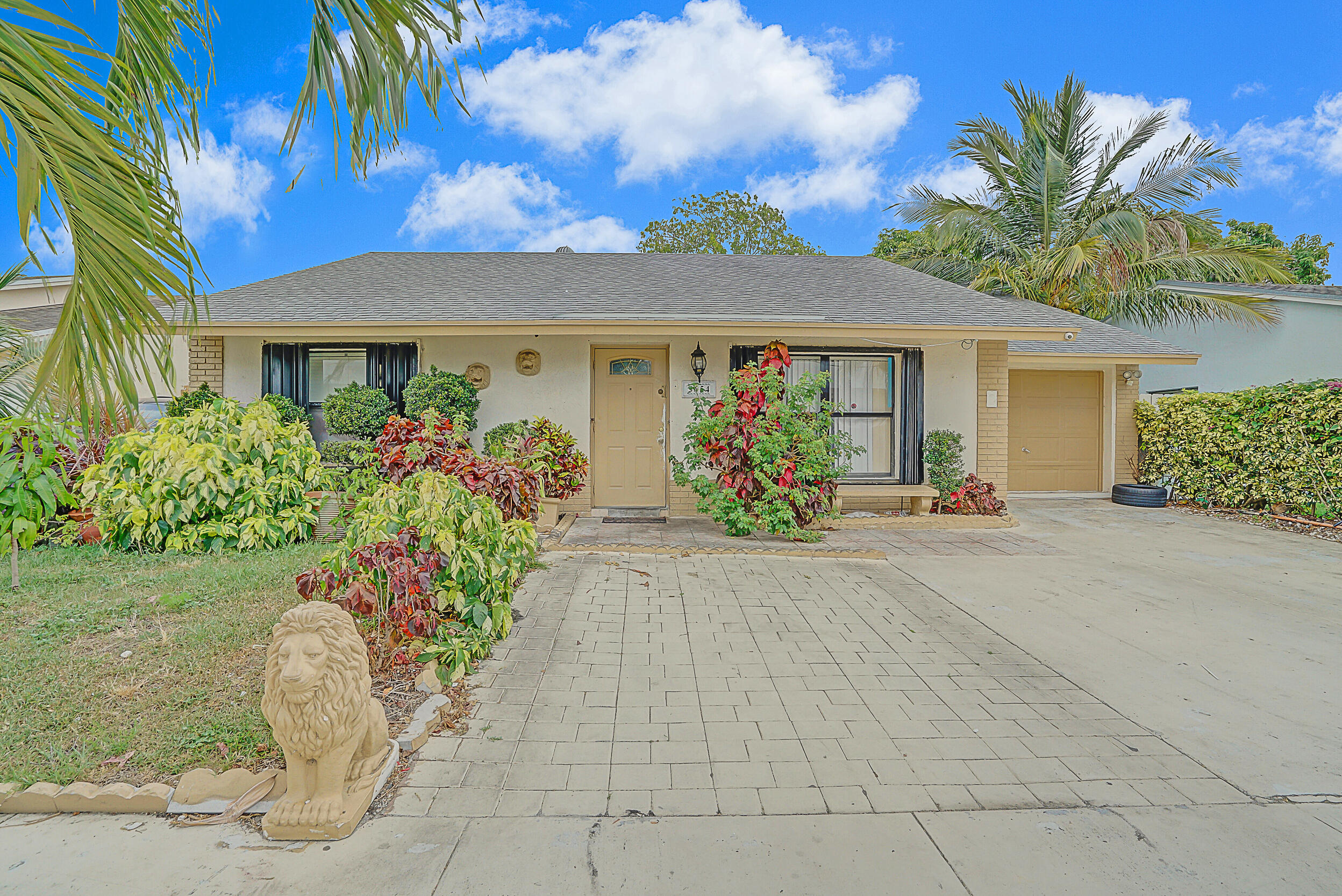 front view of a house with a yard