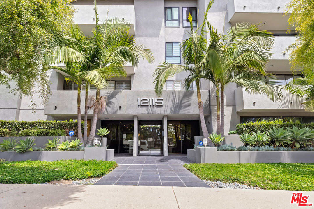 a front view of a building with garden