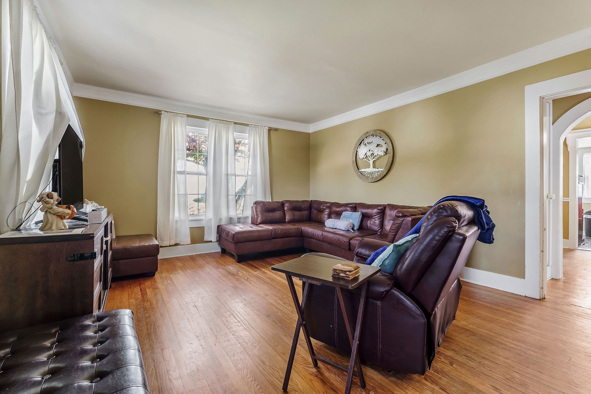 a living room with furniture and a table