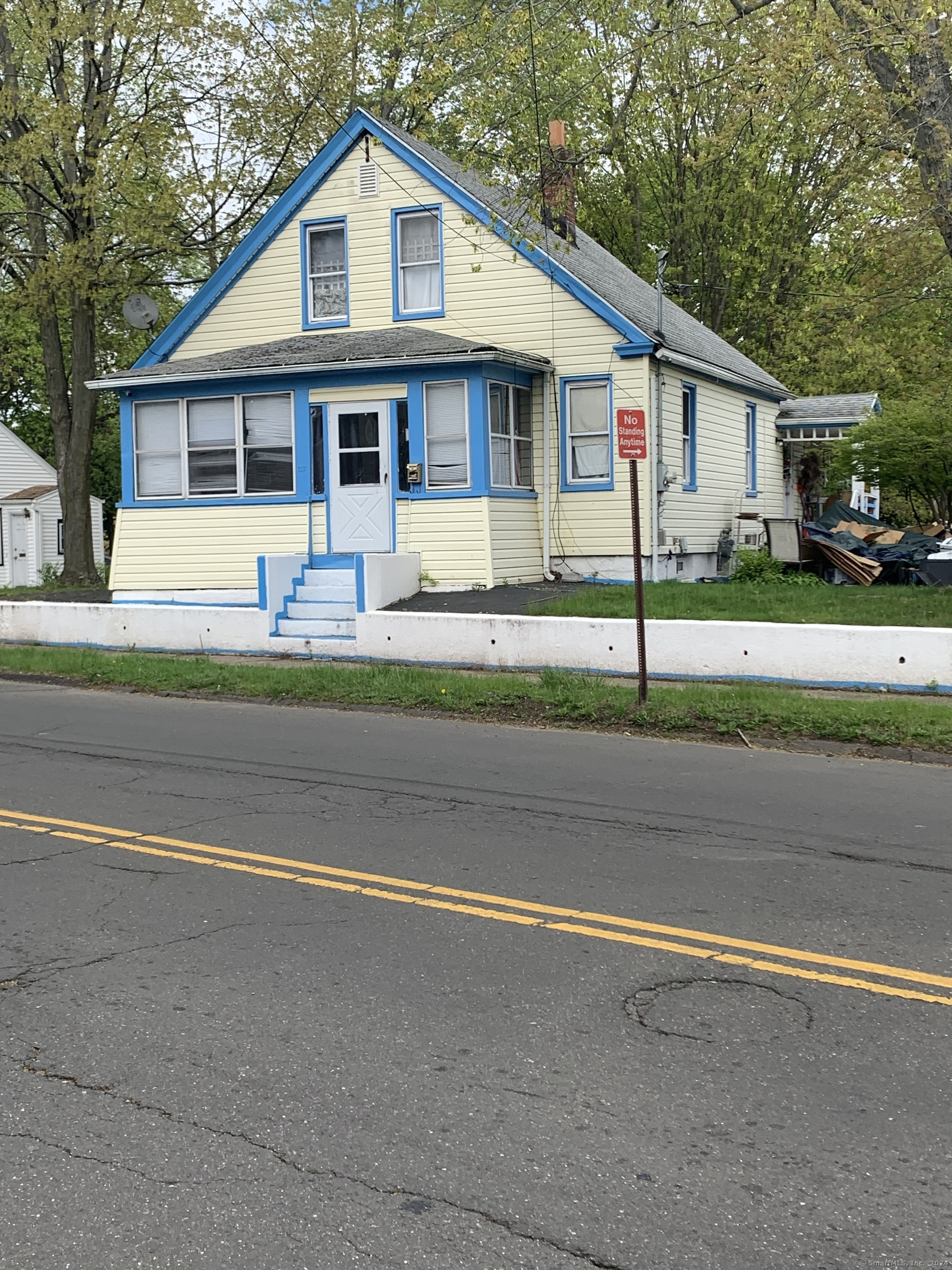 a front view of a house with a yard