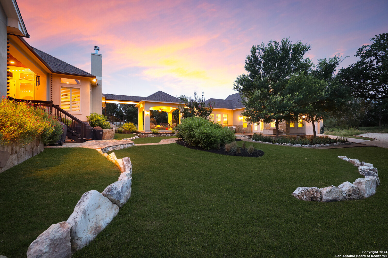 a front view of a house with garden