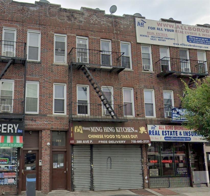 a view of a building with a street