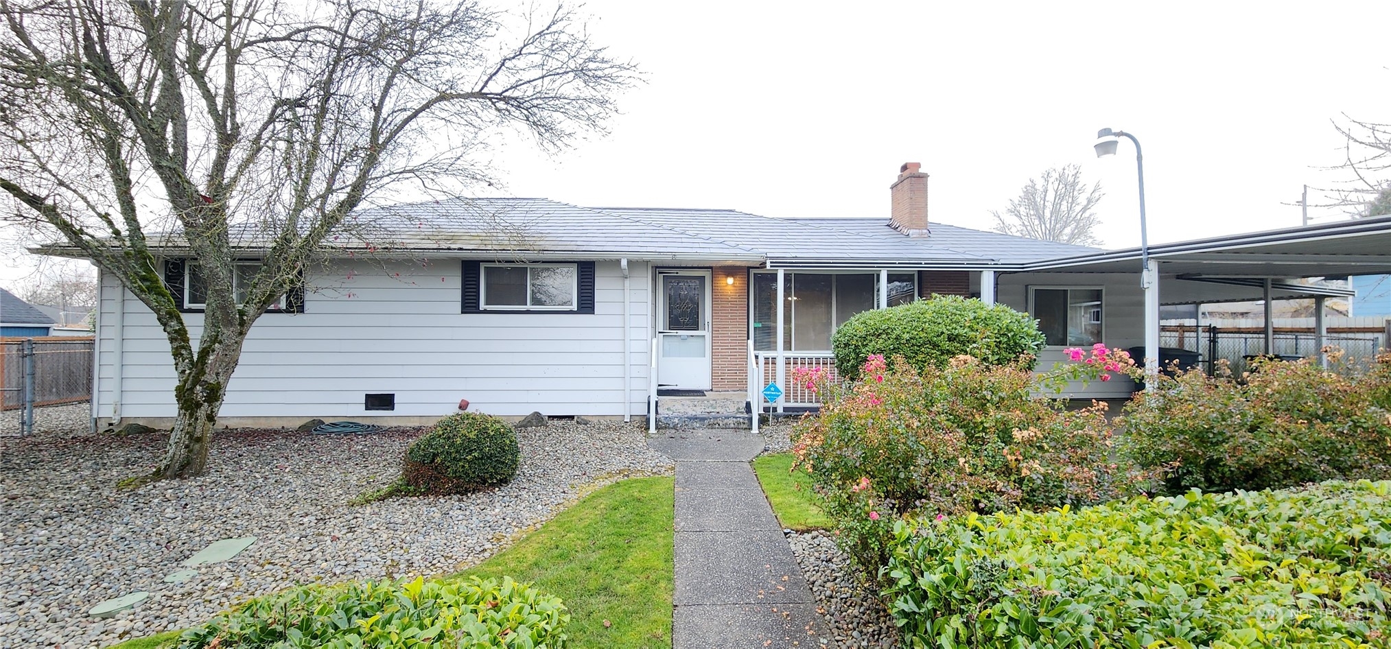 a front view of a house with garden