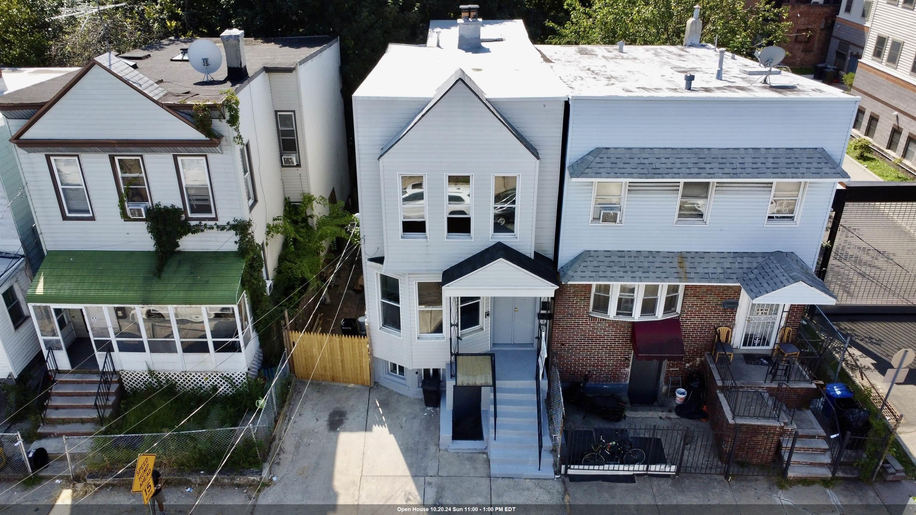 an aerial view of a house with a patio and a fireplace