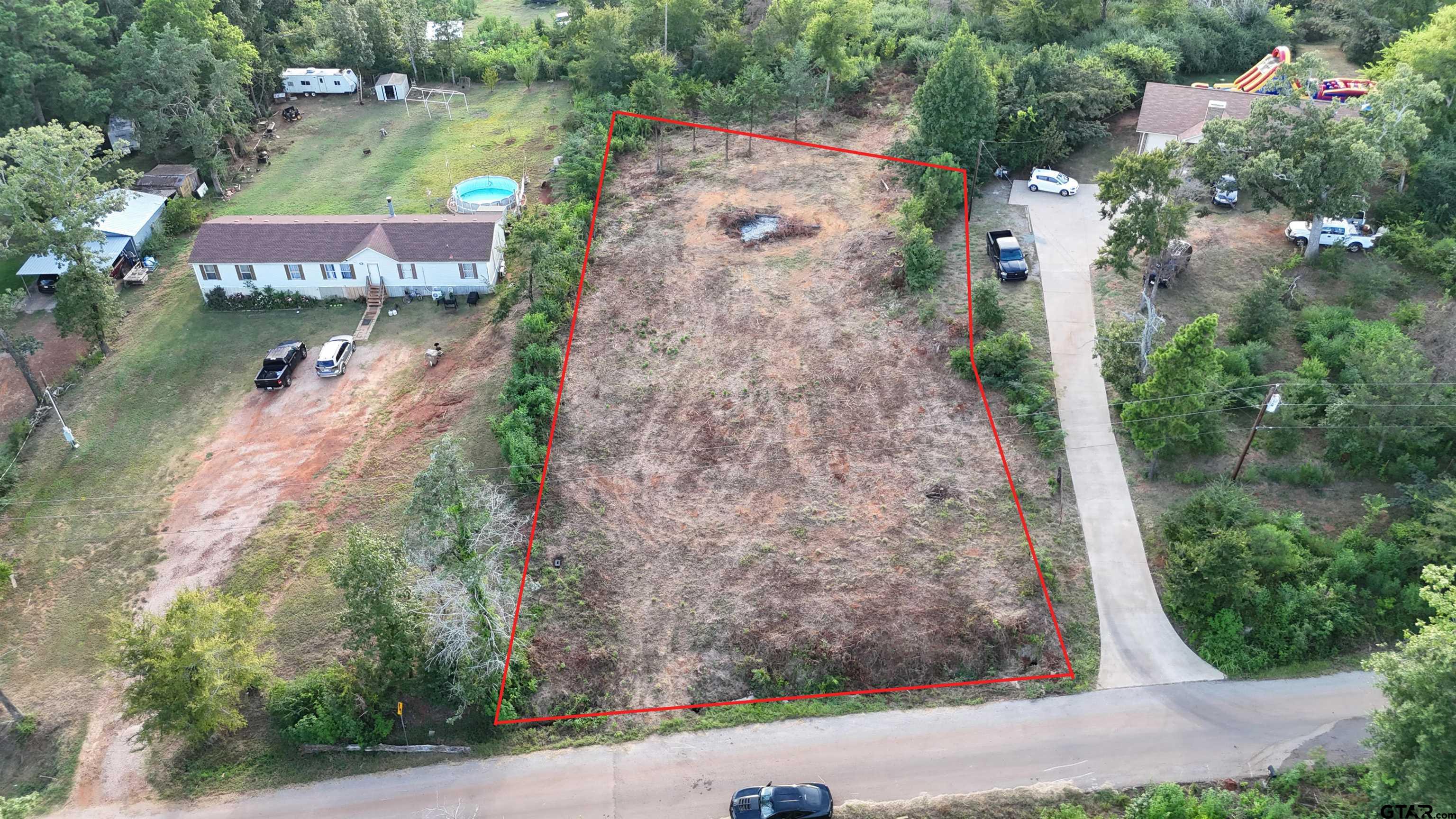 an aerial view of residential houses with outdoor space