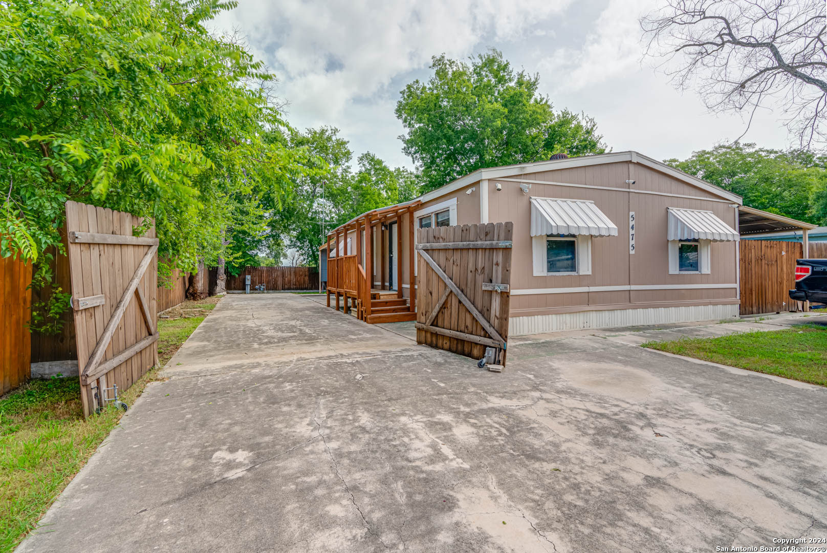 front view of a house with a yard