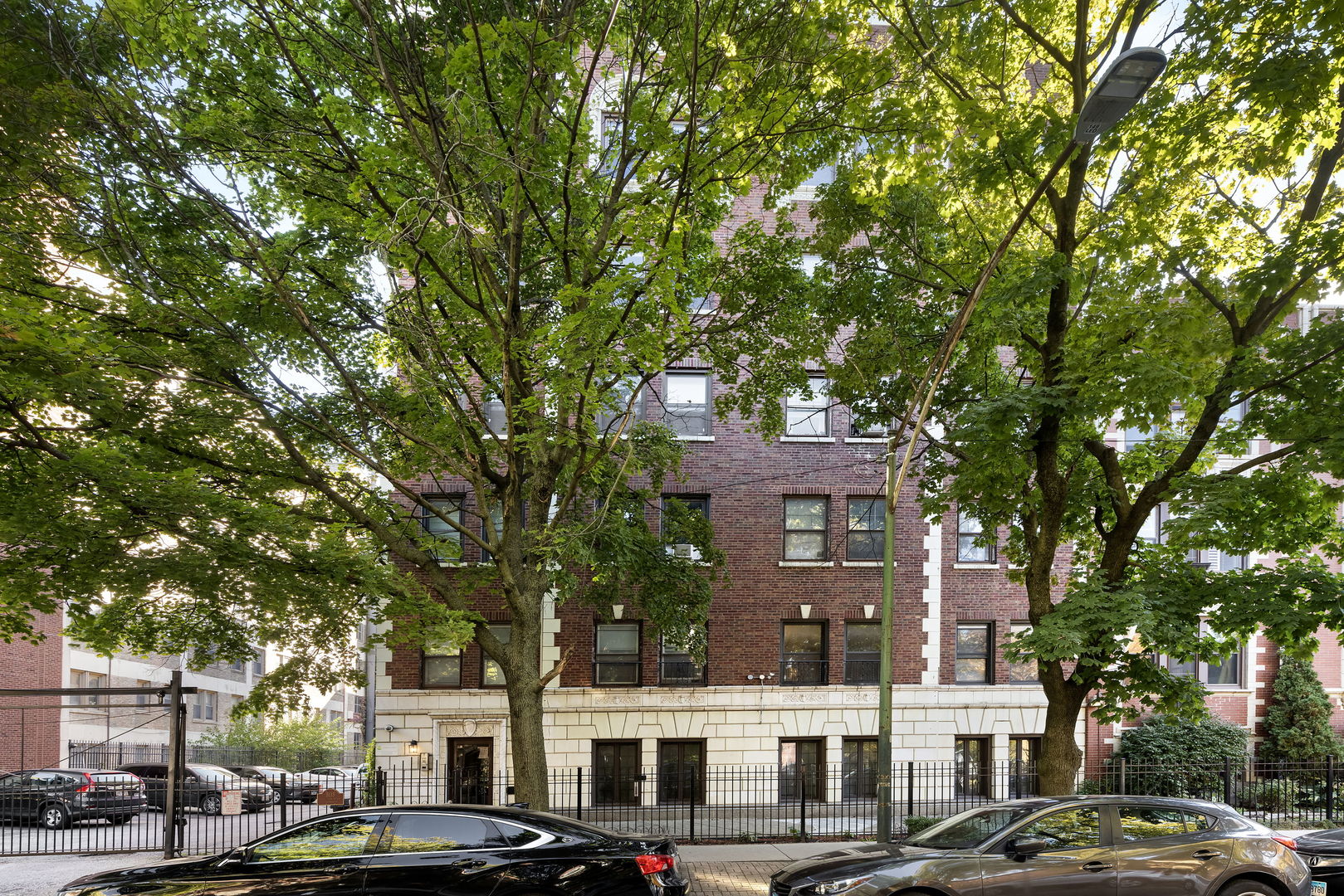 a view of a building with large trees