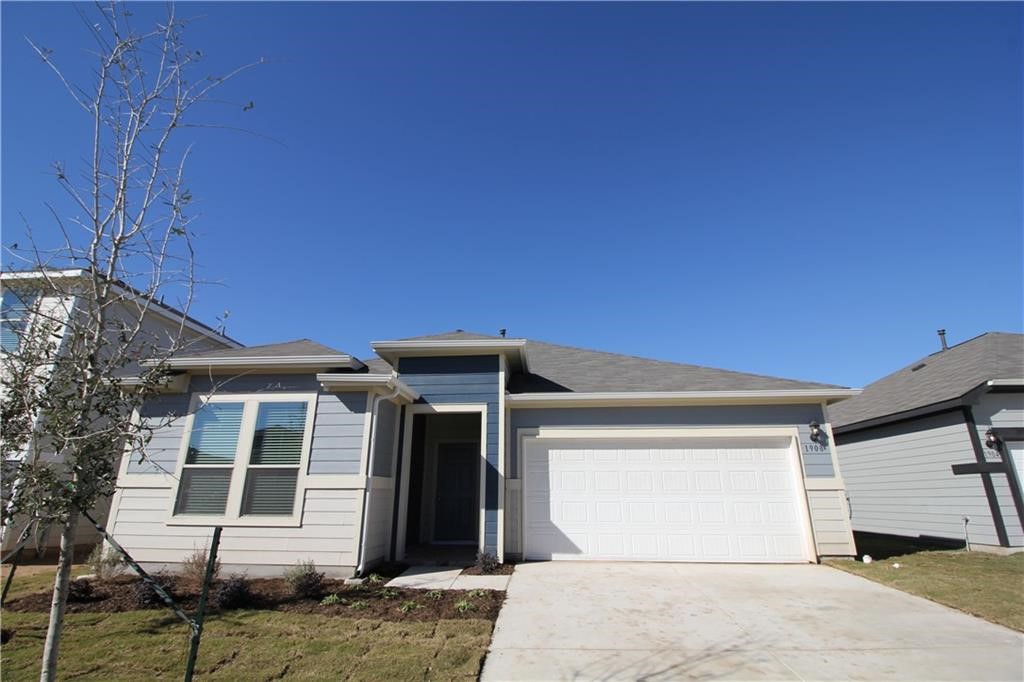 a front view of a house with a garage